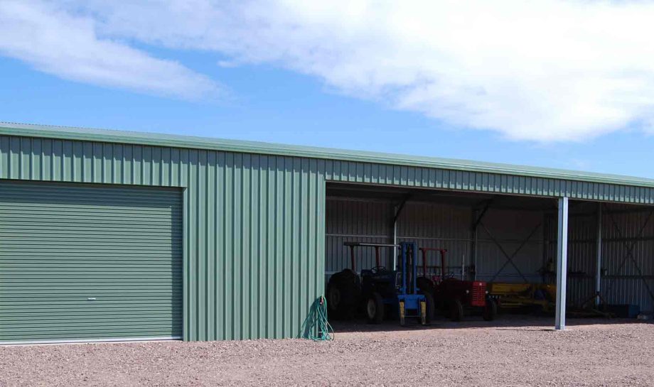 Green rural machinery shed in Perth built by large shed company Western Sheds.